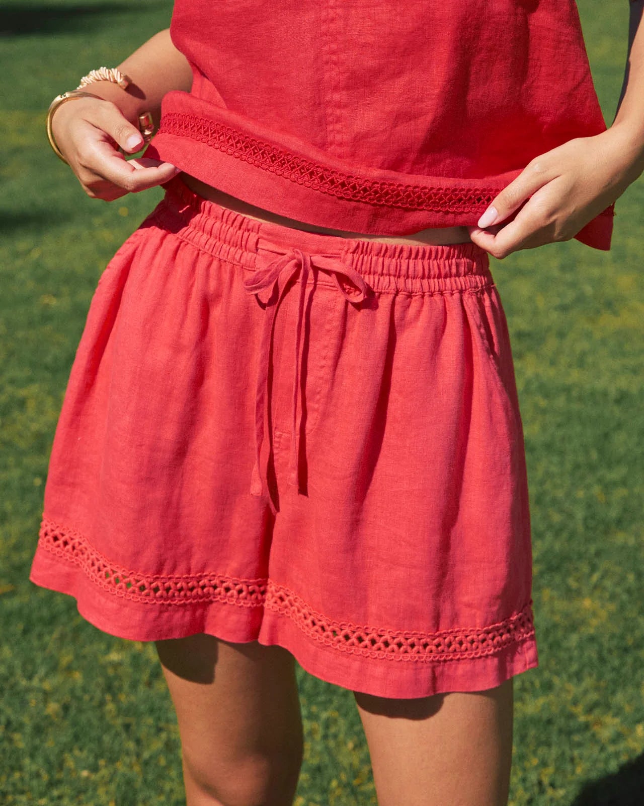 Red dress with a green grass background