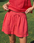 Red dress with a green grass background