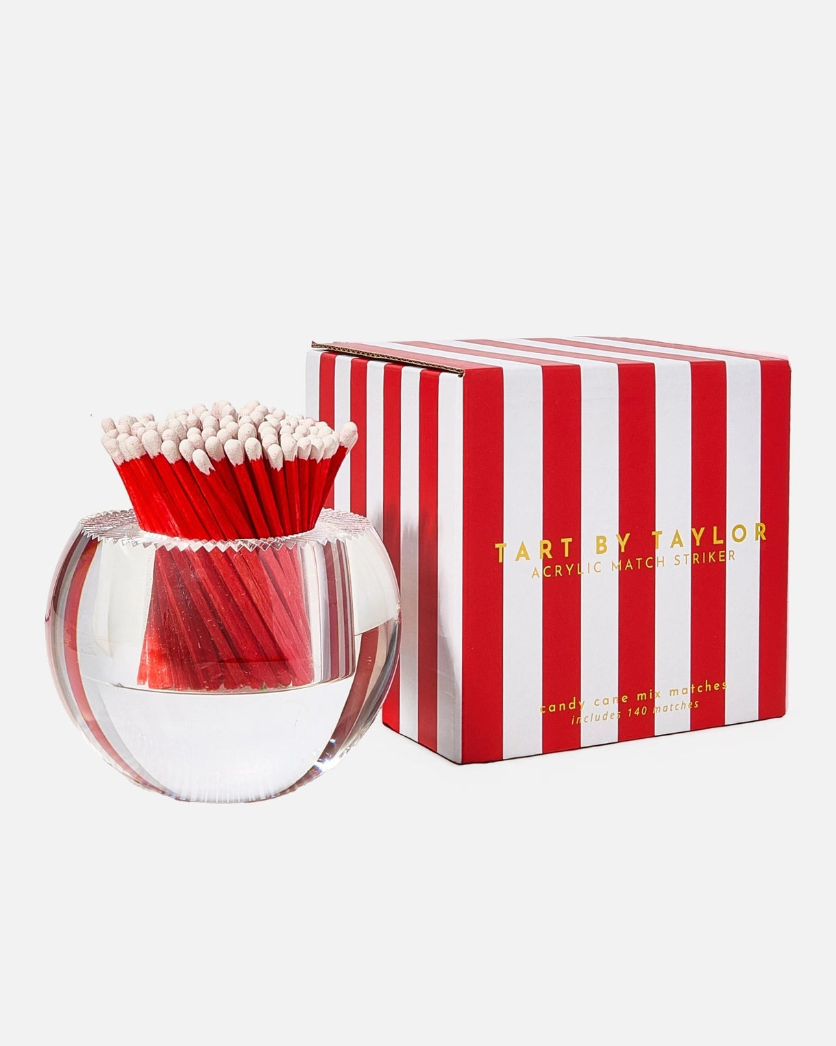 Match striker with red matches and striped packaging on a white background