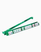 Green plastic holder with cartoon character cards on a white background