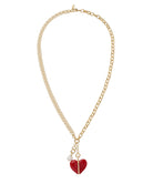 Gold chain necklace with a red heart pendant on a white background