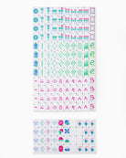 Sheet of decorative stickers with various designs on a white background