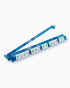 Blue weekly pill organizer with colorful labels on a white background
