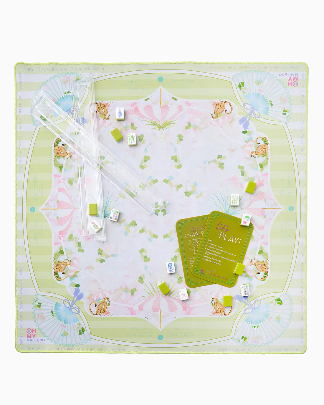 Children's play mat with cartoon animals and game components on a white background
