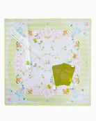 Children's play mat with cartoon animals and game components on a white background