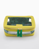 Yellow cosmetic bag with clear section and green tassel on a white background