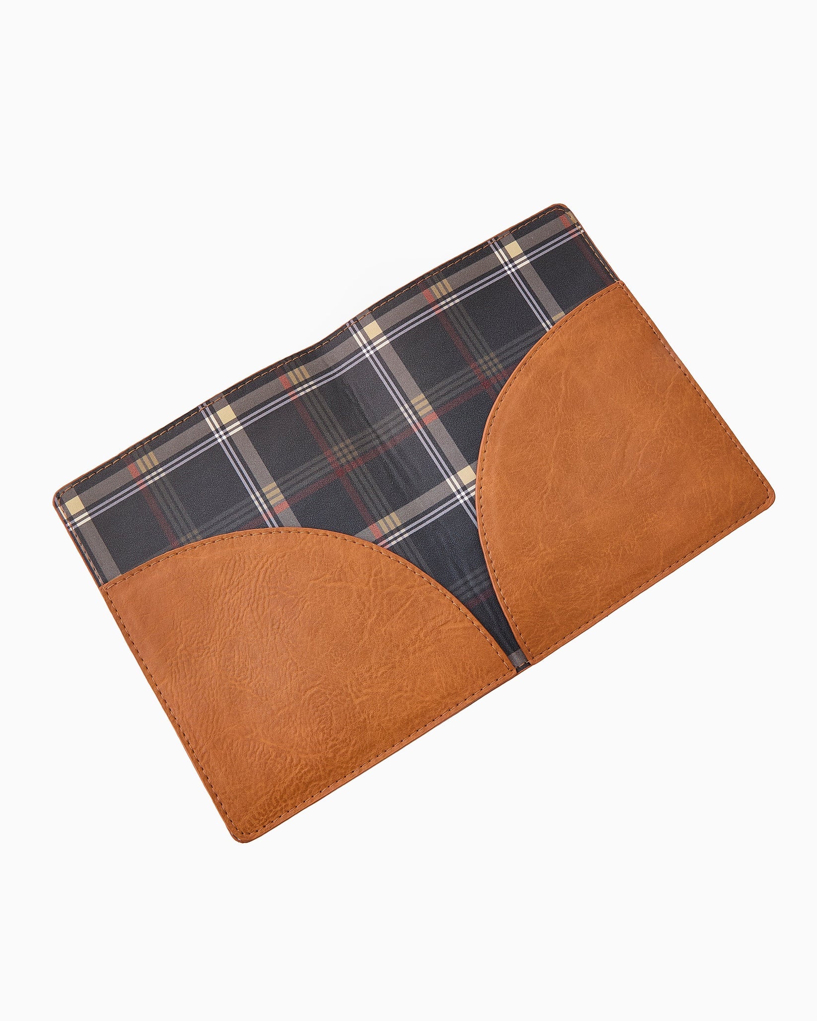 Plaid fabric with brown leather patch on a white background