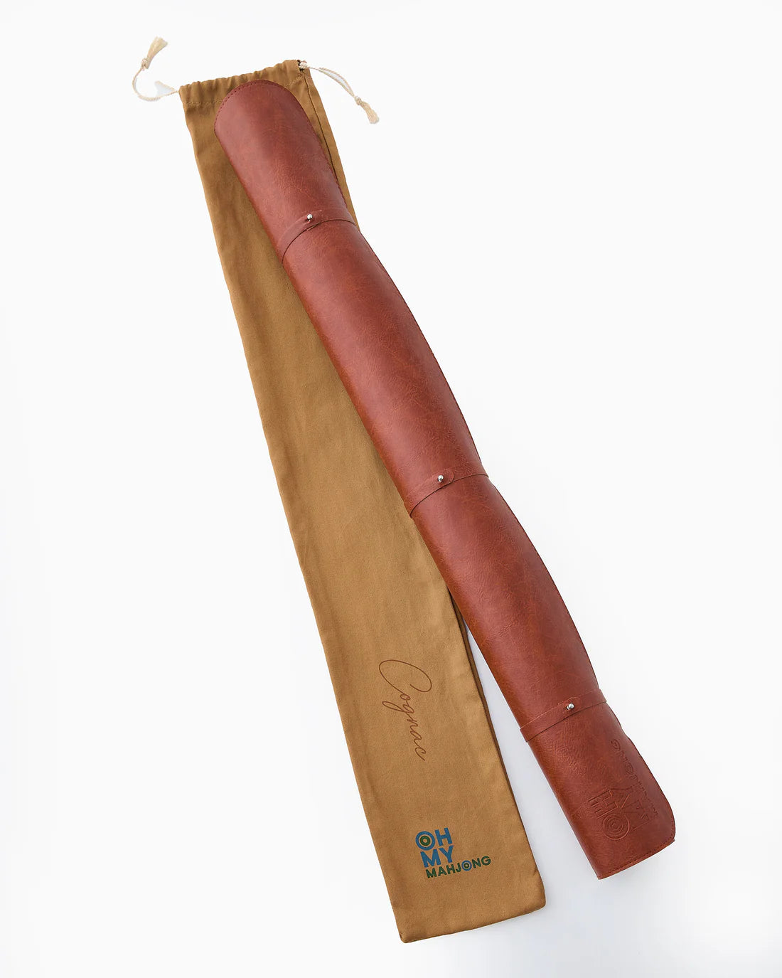 Brown leather travel mat with drawstring bag on a white background