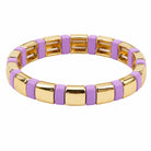 Gold and purple bracelet on a white background