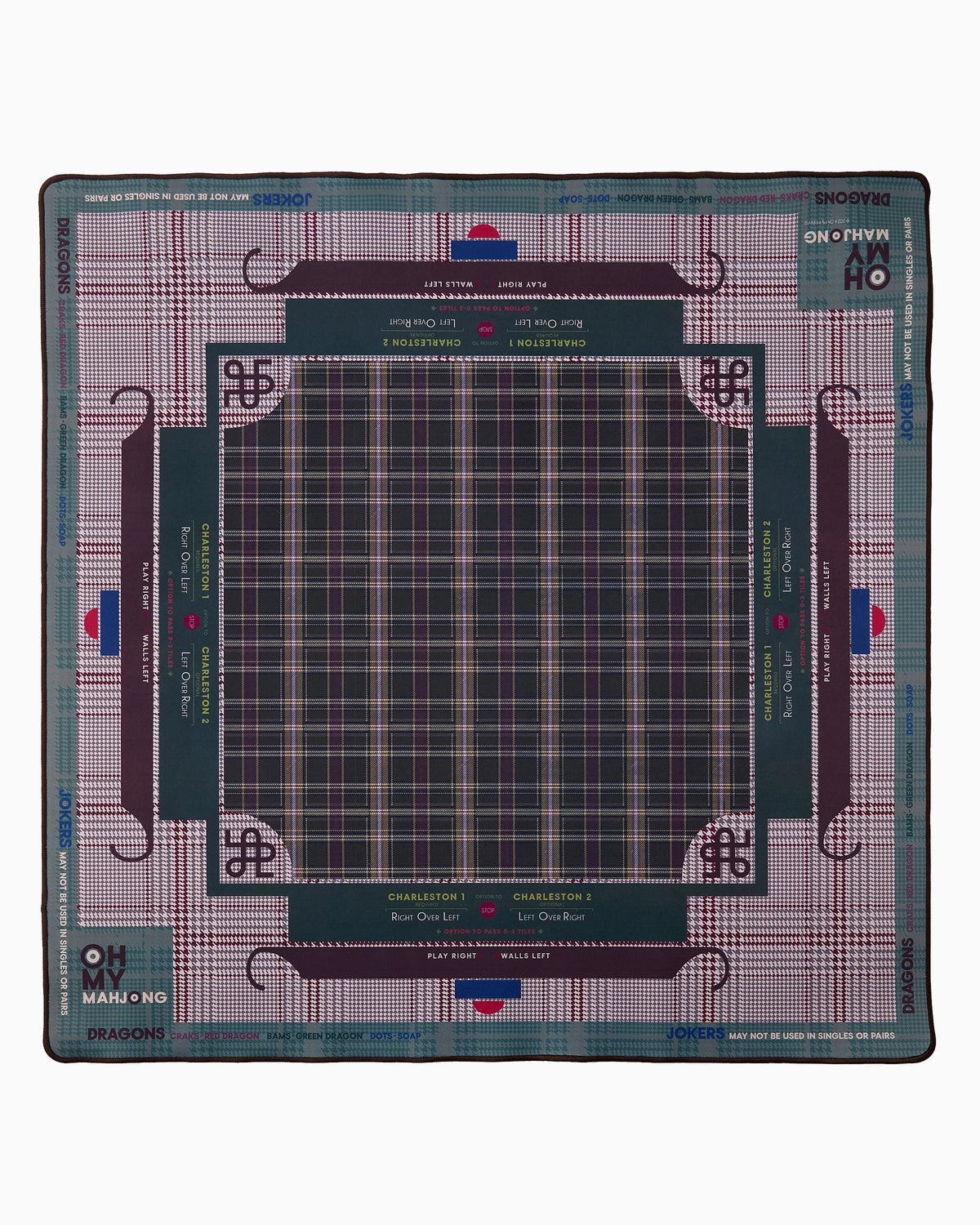 A square collectible gaming mat featuring a detailed board layout for the game Mangolo Ngo. The mat has a dark teal center with a plaid grid, surrounded by a purple and teal plaid border, and printed with game rules, player names, and the Mangolo Ngo logo.