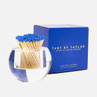 Match striker with blue matches and packaging labeled 'Tart by Taylor' on a white background
