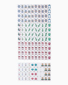 Collection of small stickers with various designs on a white background
