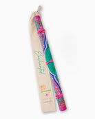 Colorful maraca with a carrying strap on a white background