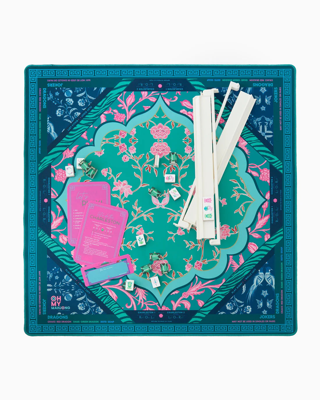 Decorative board with floral design and game components on a white background