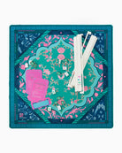 Decorative board with floral design and game components on a white background