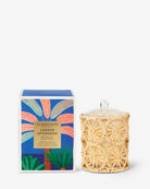 Candle with decorative packaging on a white background