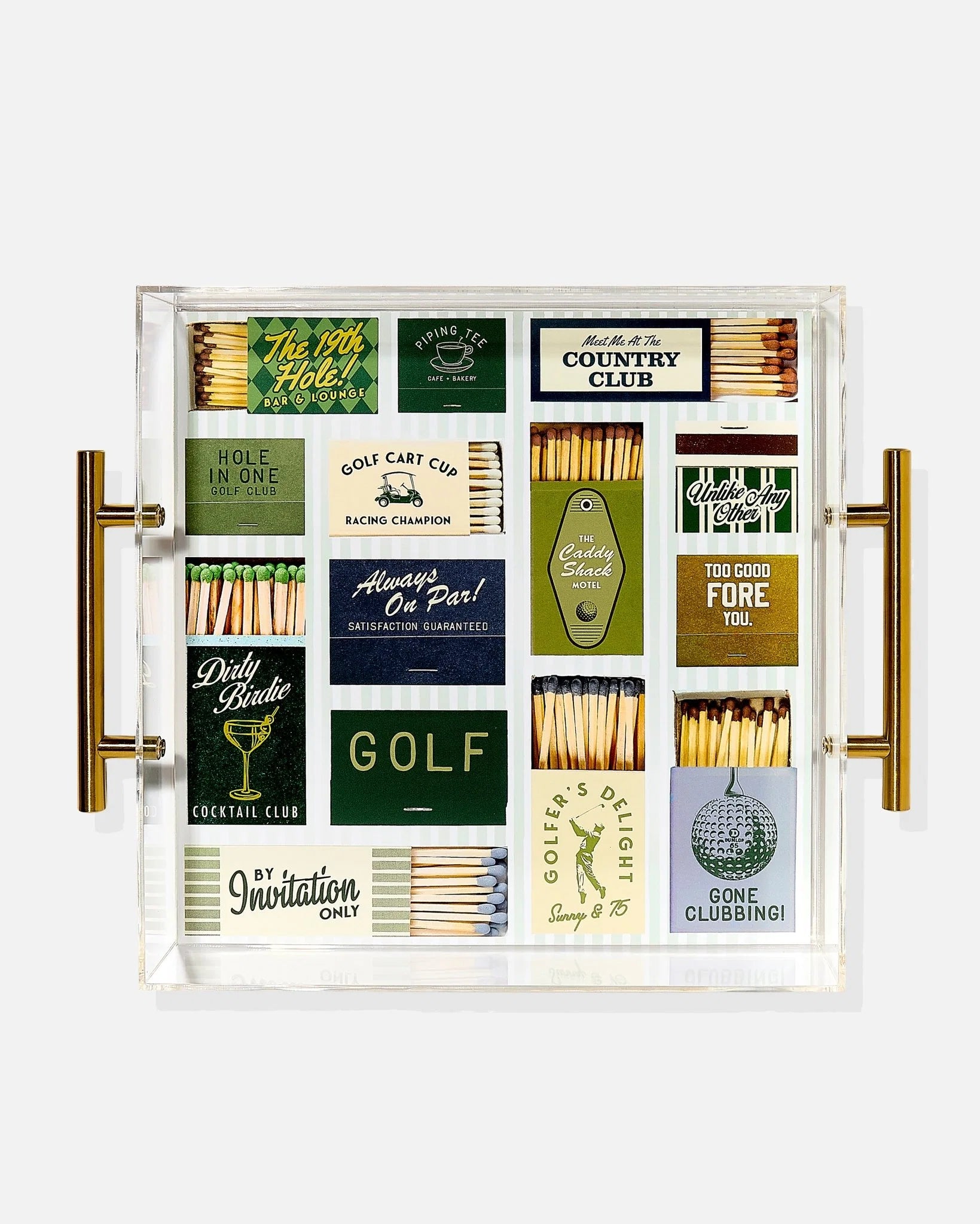 Collection of matchboxes with golf-themed labels in a decorative case.