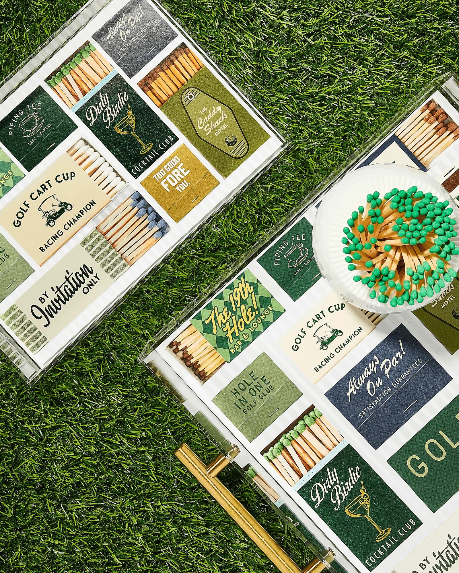 Matches with decorative labels on a grassy surface