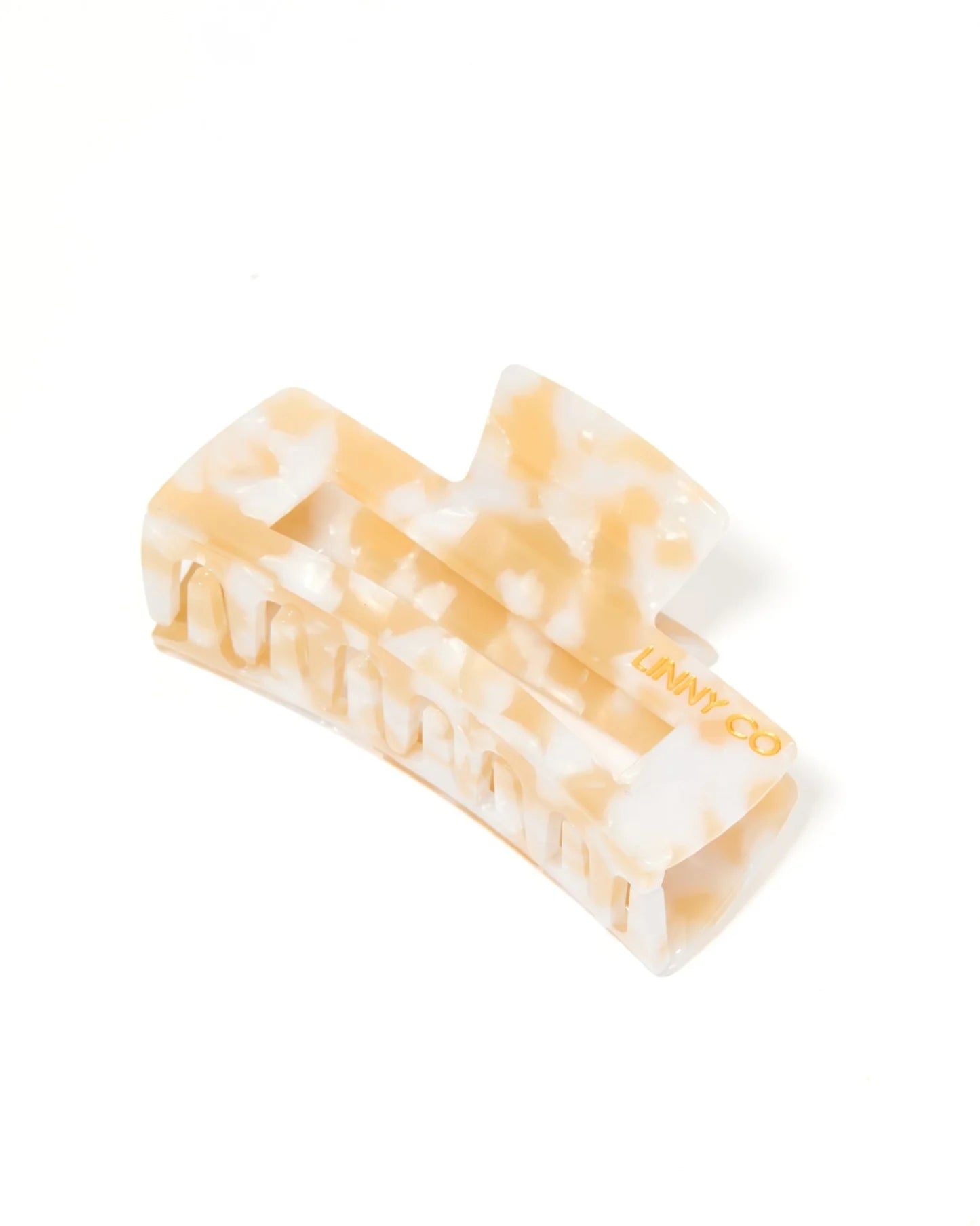 Marbled rectangular object with 'Lumin' branding on a white background