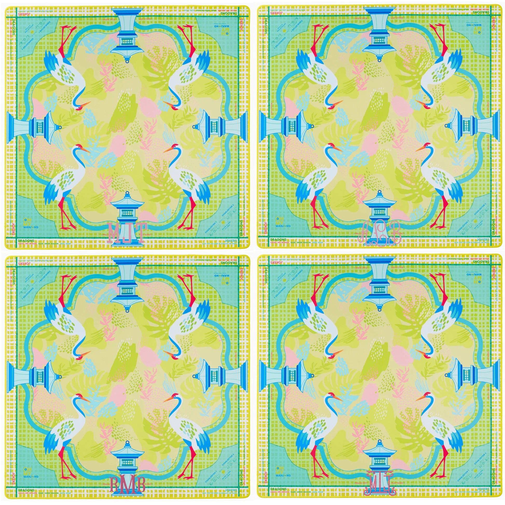 Four identical colorful placemats with a design of birds and a pagoda.
