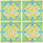 Four identical colorful placemats with a design of birds and a pagoda.