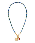 Necklace with a blue patterned cord and gold heart pendant on a white background