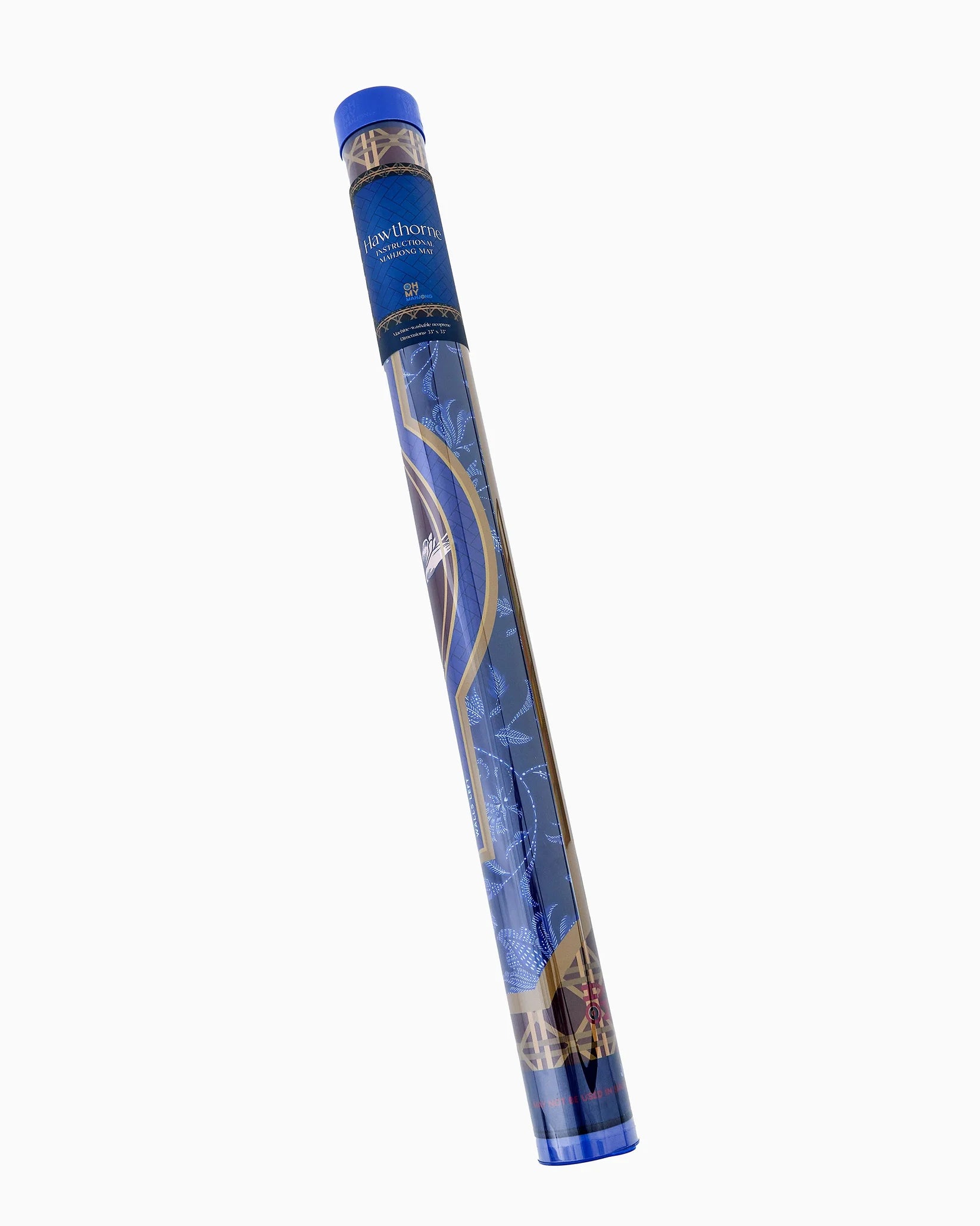 A rolled-up blue and gold patterned mat or rug shown diagonally on a plain white background. The top cap is blue, and the roll features decorative gold and white line art on a blue base.