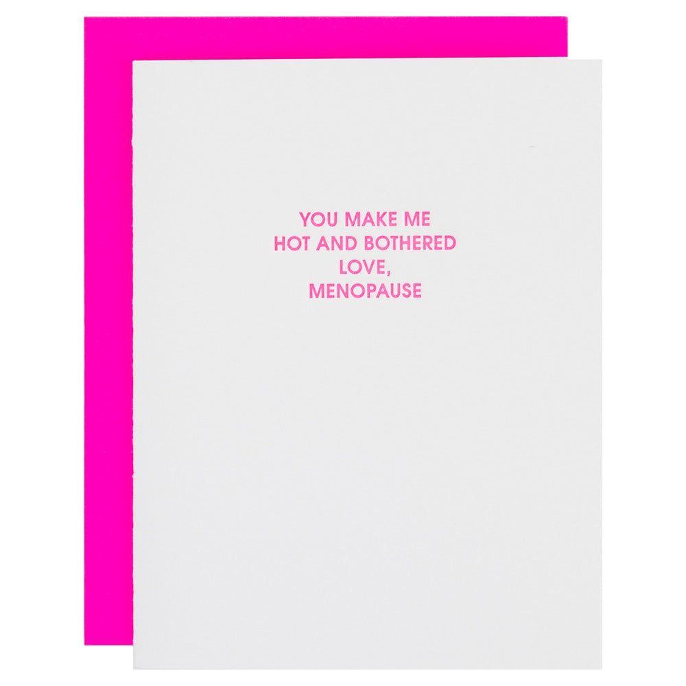 Card with pink border and humorous text about menopause on a white background