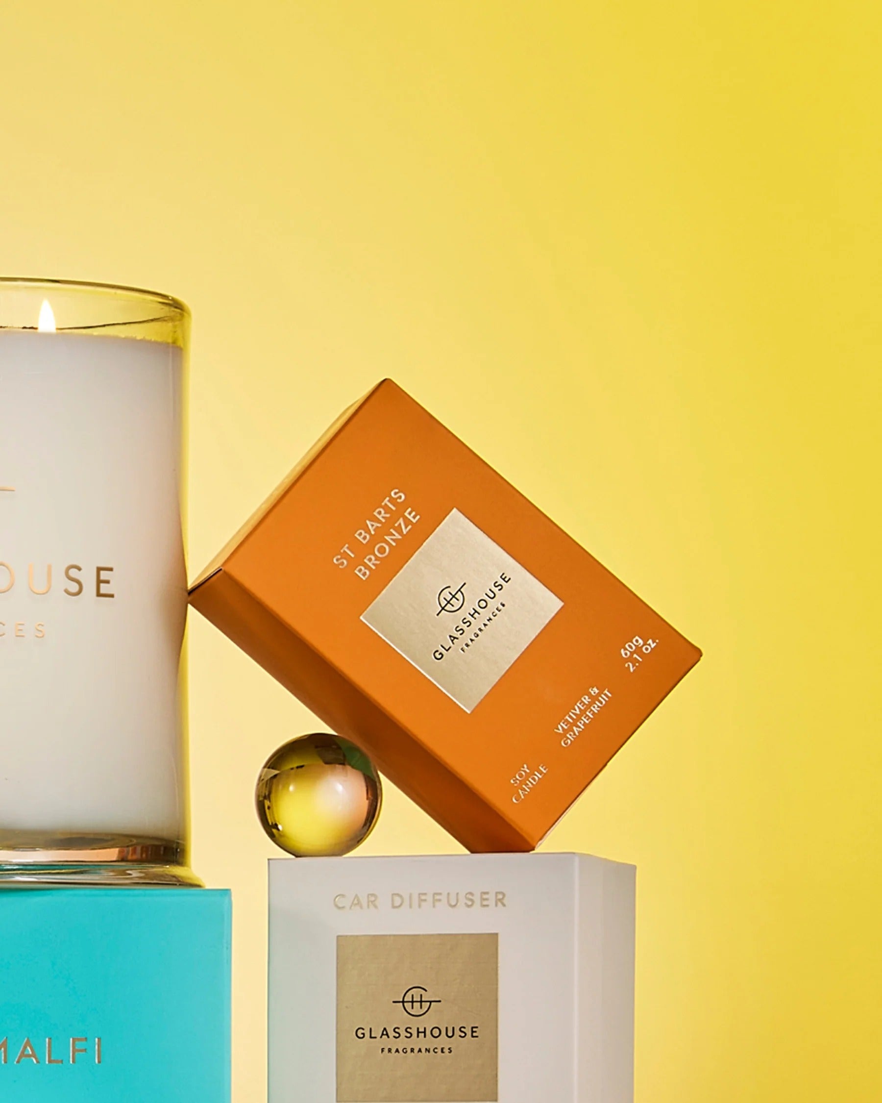 Glasshouse candles and diffusers on a yellow background