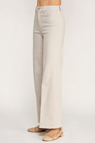 Beige wide-leg jeans on a white background