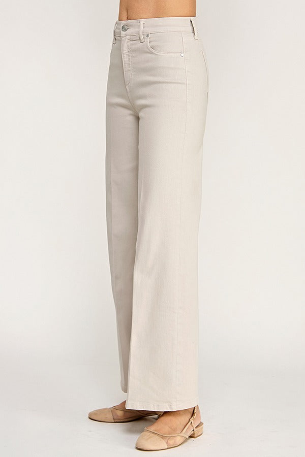 Beige wide-leg jeans on a white background