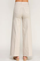 Beige wide-leg pants on a white background