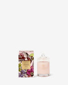 Candle and packaging with floral design on a white background
