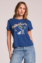Woman wearing a blue t-shirt with 'aperitivo' design on a plain background