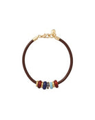 Bracelet with brown leather strap and colorful beads on a white background