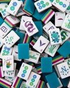 Colorful game tiles with various designs and numbers on a white background