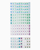 Sheet of temporary tattoos with various designs on a white background