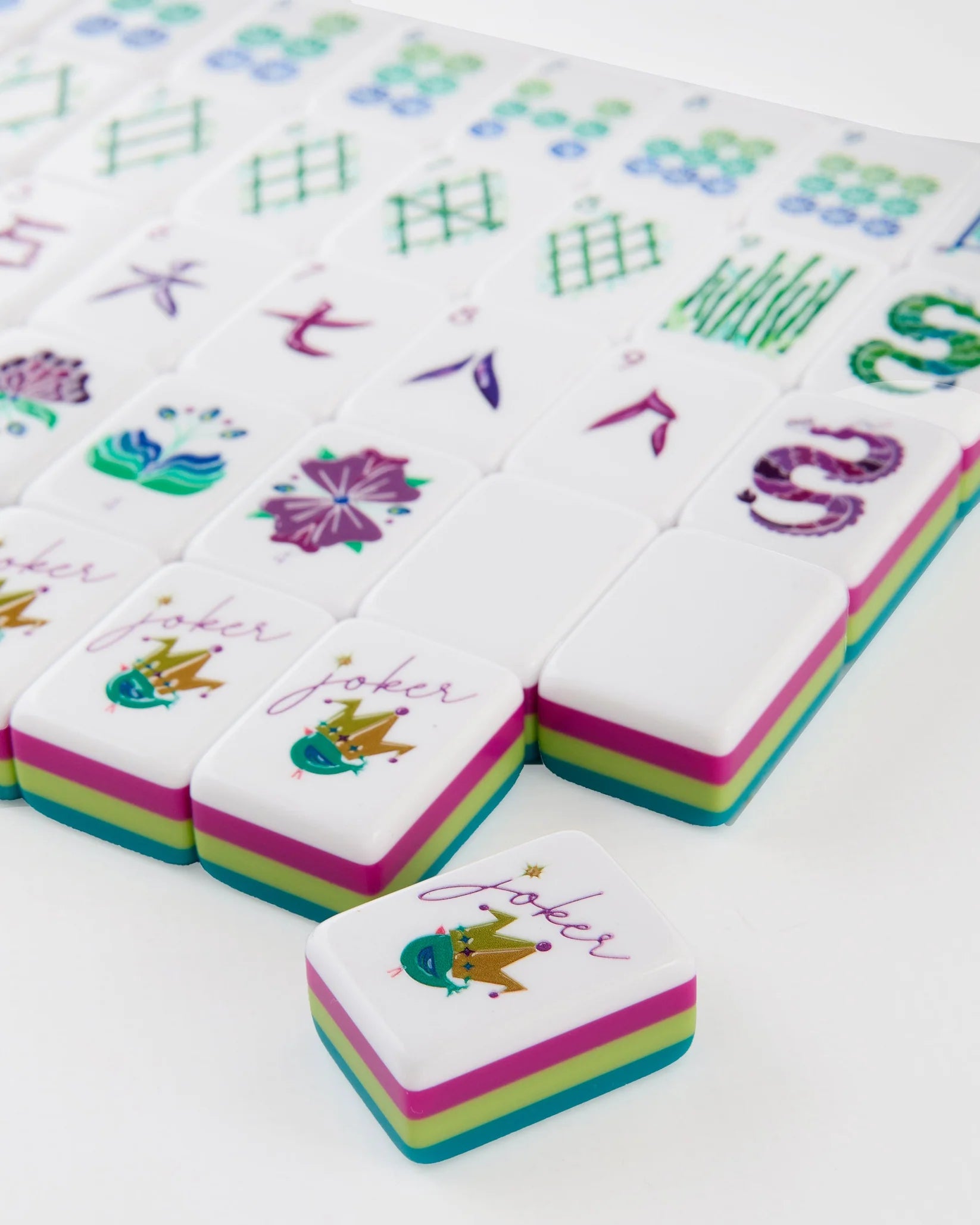 Colorful麻将 tiles with cartoon characters on a white background