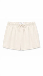 Beige shorts with a drawstring on a white background