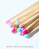 Matches with colorful tips on a white background, text 'Match Refills Available' at the bottom.
