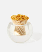 Clear glass container with wooden matches on a white background