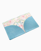 Placemat with floral pattern and blue border on a white background