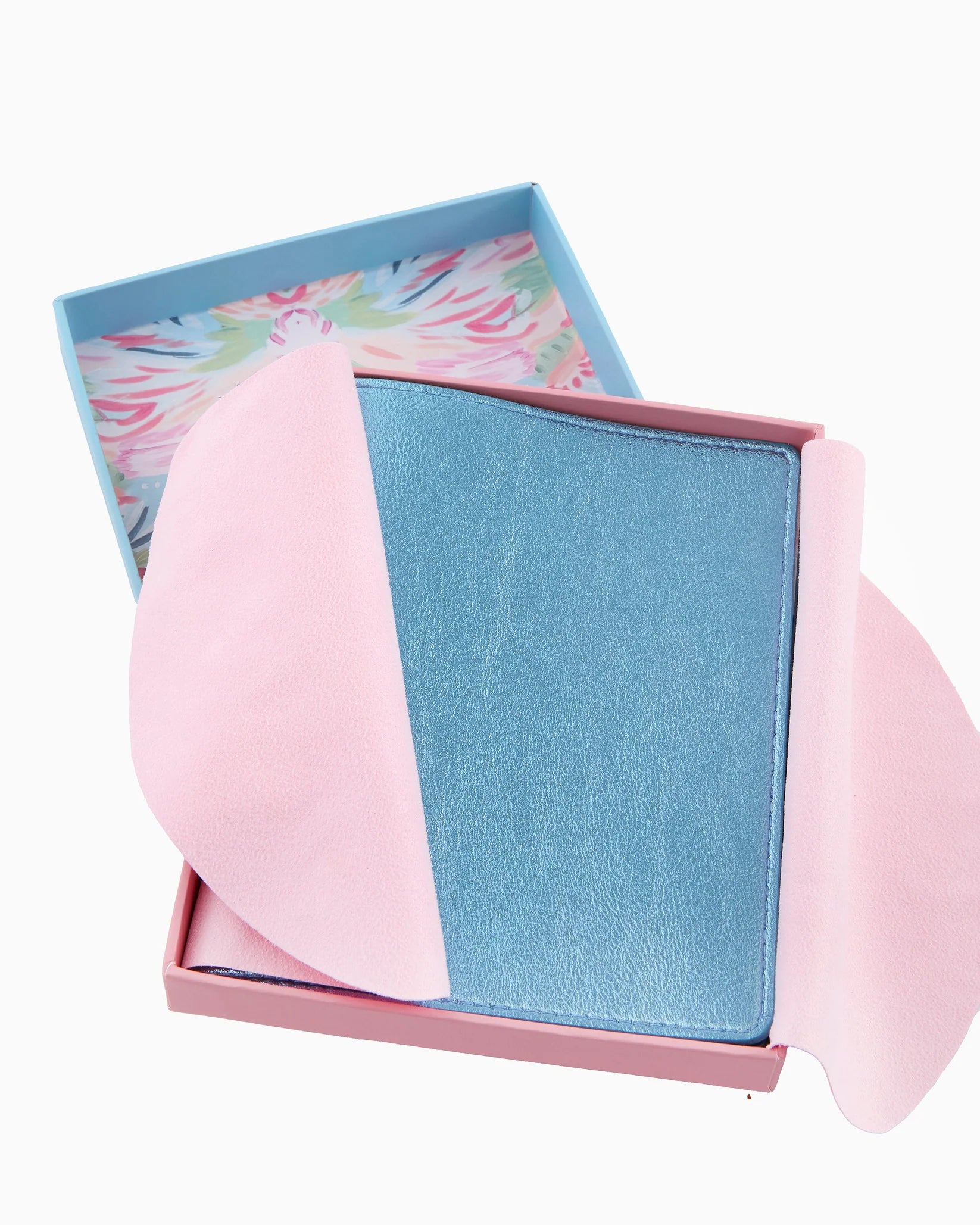 Pink and blue wallet with floral patterned box on a white background