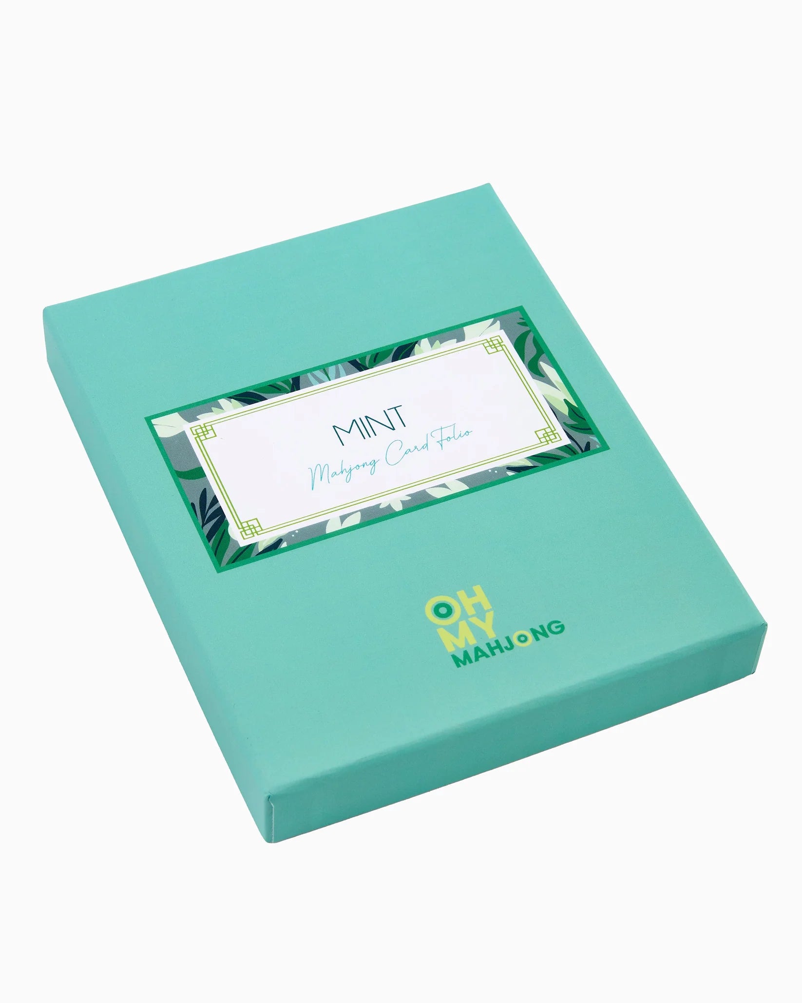 Mint green packaging box with a card inside, featuring 'Oh My Mahjong' branding.