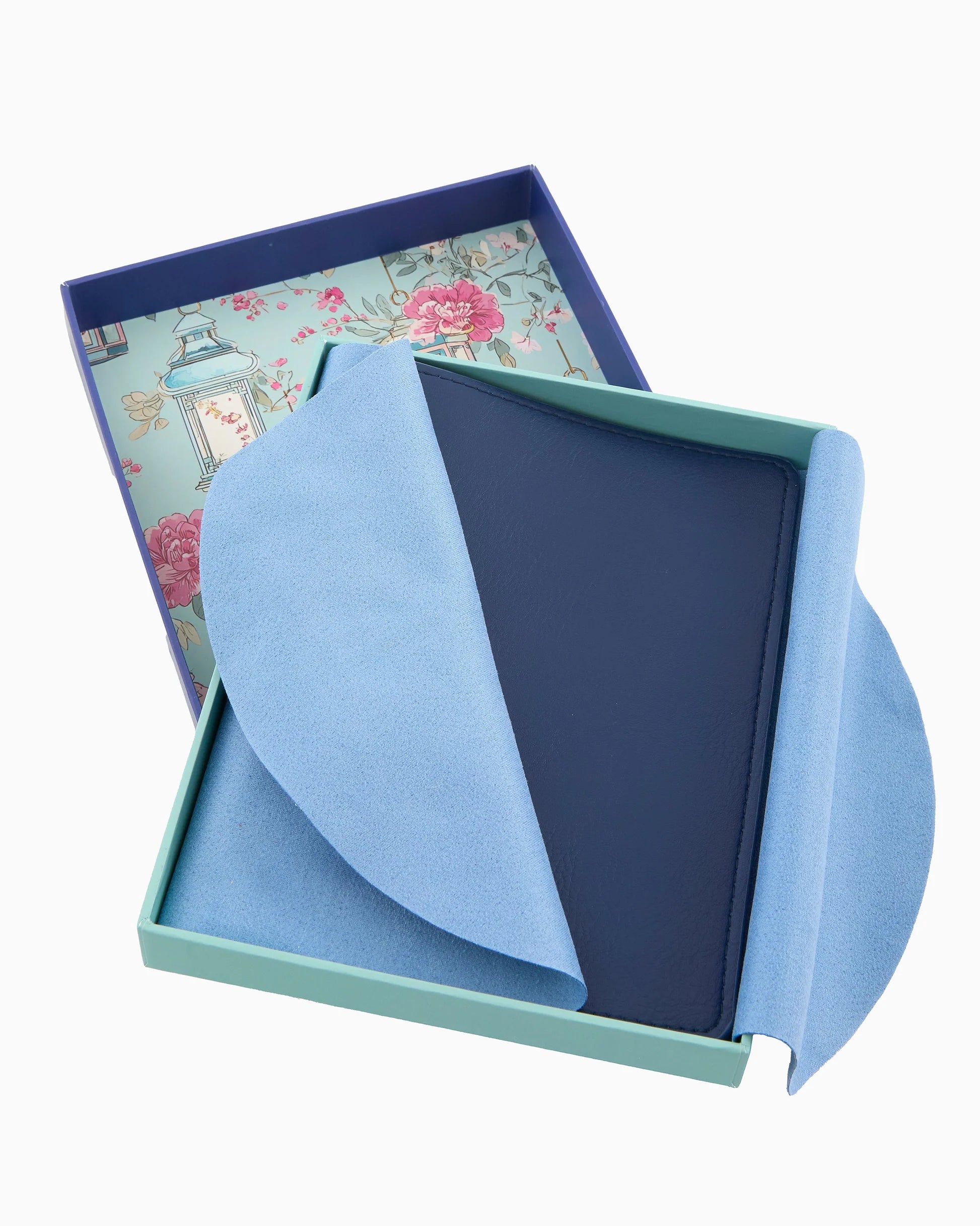 Blue stationery set with a floral-patterned box on a white background
