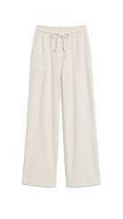 A pair of wide-leg lounge pants in a light cream or off-white color, featuring an elastic waistband with a drawstring and two front patch pockets, shown against a plain white background.
