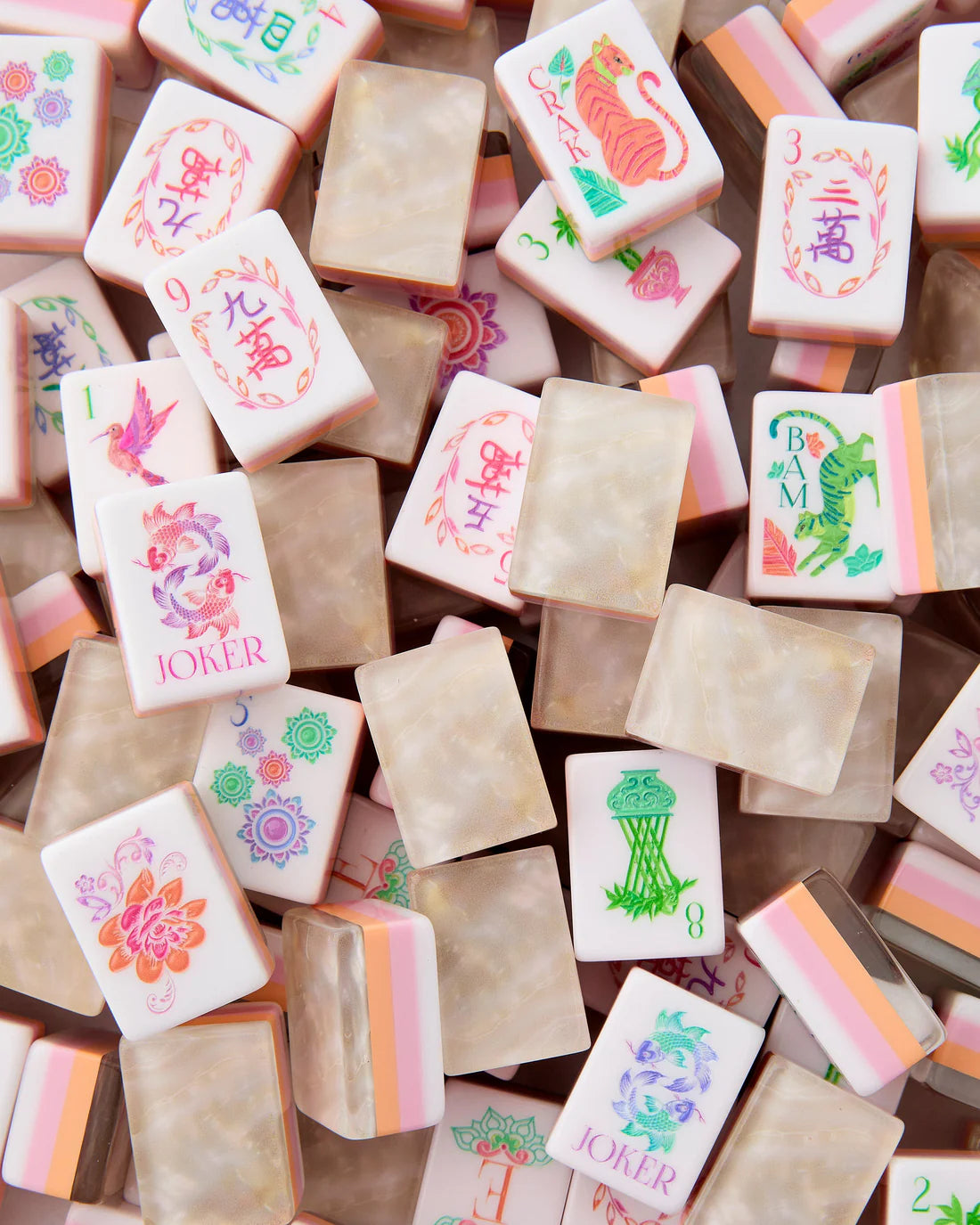 Collection of colorful stamp pads with various designs on a wooden surface