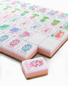 Decorative chocolate candies with colorful designs on a white background