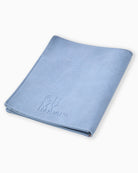 Blue towel with 'Oh My! Maman' branding on a white background