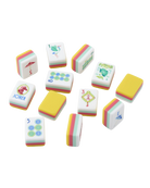 A set of miniature Mahjong-style tiles arranged on a plain white background. The tiles are primarily white with multicolored striped edges and various printed symbols and illustrations.